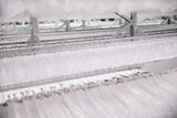 Glimpse at shirt racking inside ACS Clothing Warehouse