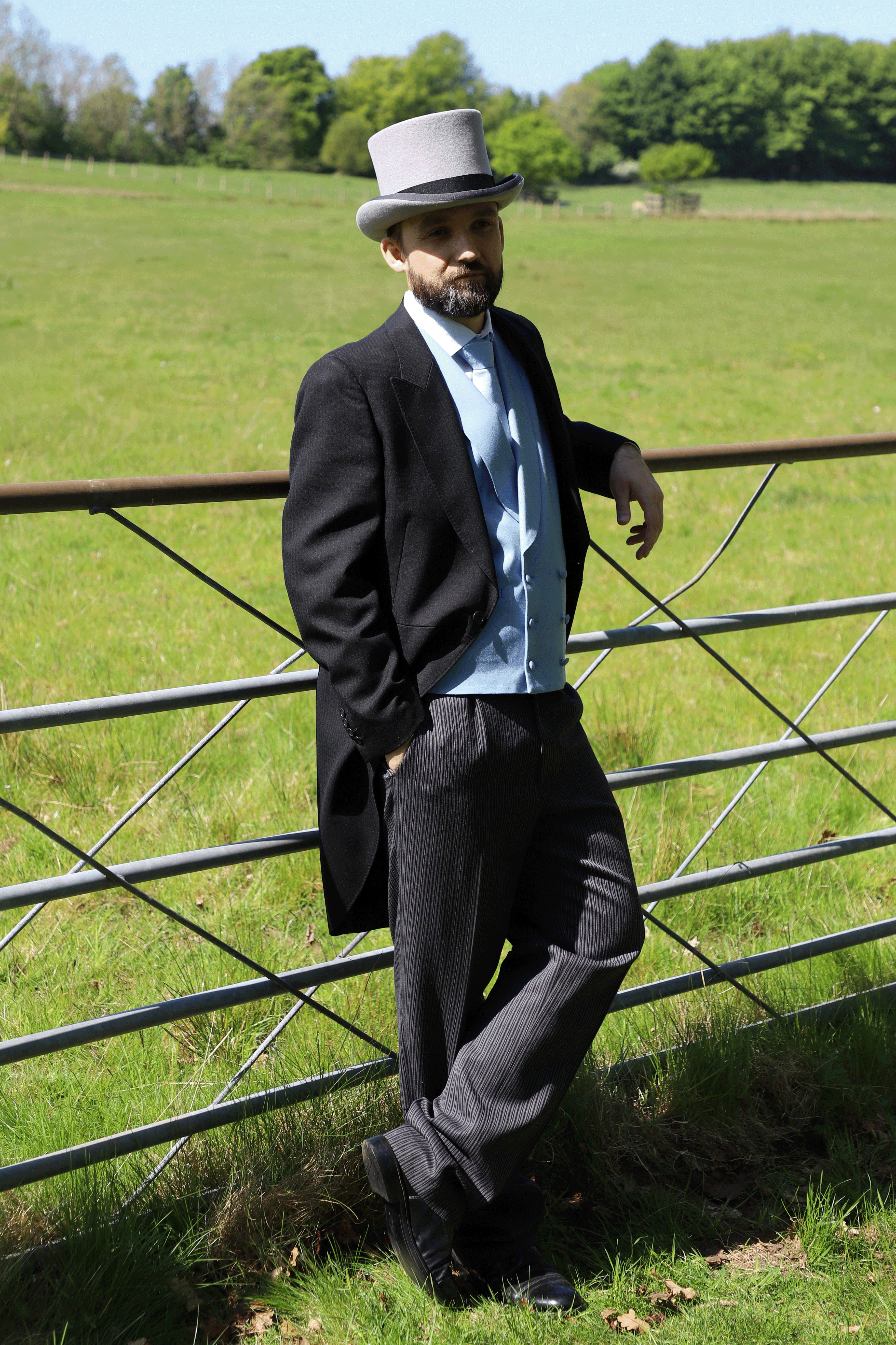 Model wears Black Tailcoat, Blue Double Breasted & Grey Stripe Trousers Hire Package