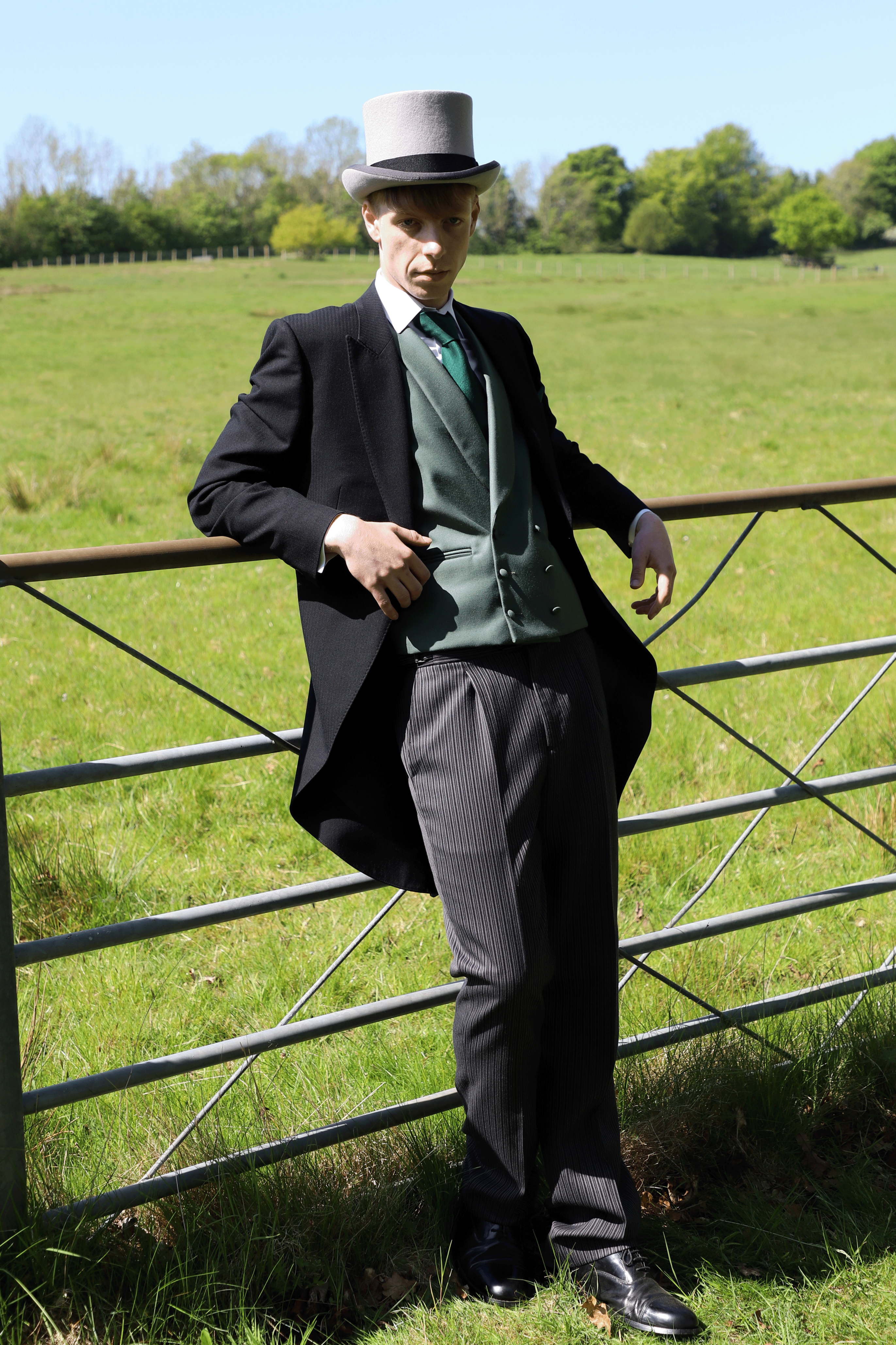 Model wears Black Tailcoat, Green Double Breasted & Grey Stripe Trousers Hire Package
