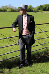 Model wears Black Tailcoat, Pink Double Breasted & Grey Stripe Trousers Hire Package