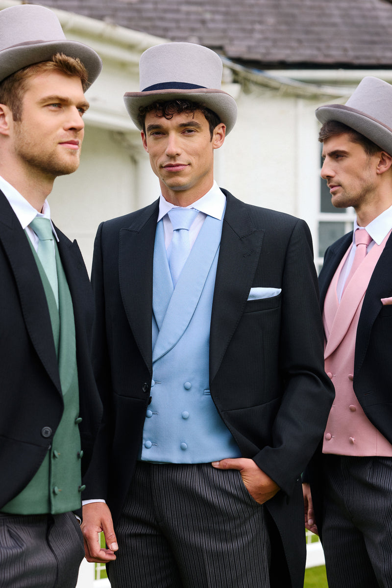 Three men in Royal Ascot approved suits with top hats standing outdoors.