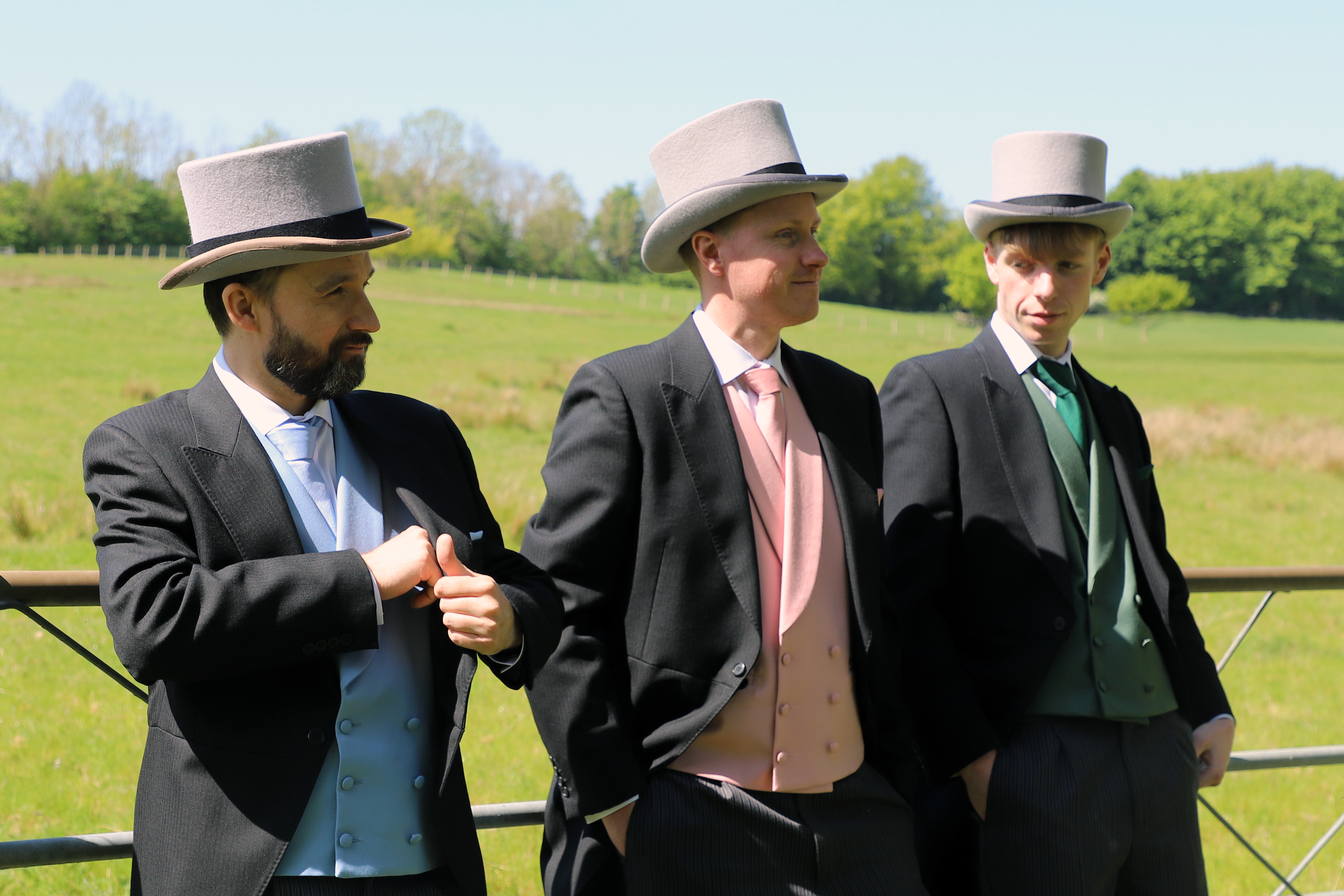 3 men wearing Black Morning Suits from ACS Rental with Assorted waistcoats and accessories