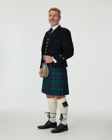 Man wearing a Black Watch kilt and Argyll Jacket with a white background