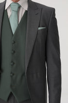 Grey slim fit tailcoat close up to green waistcoat with matching tie and pocket square