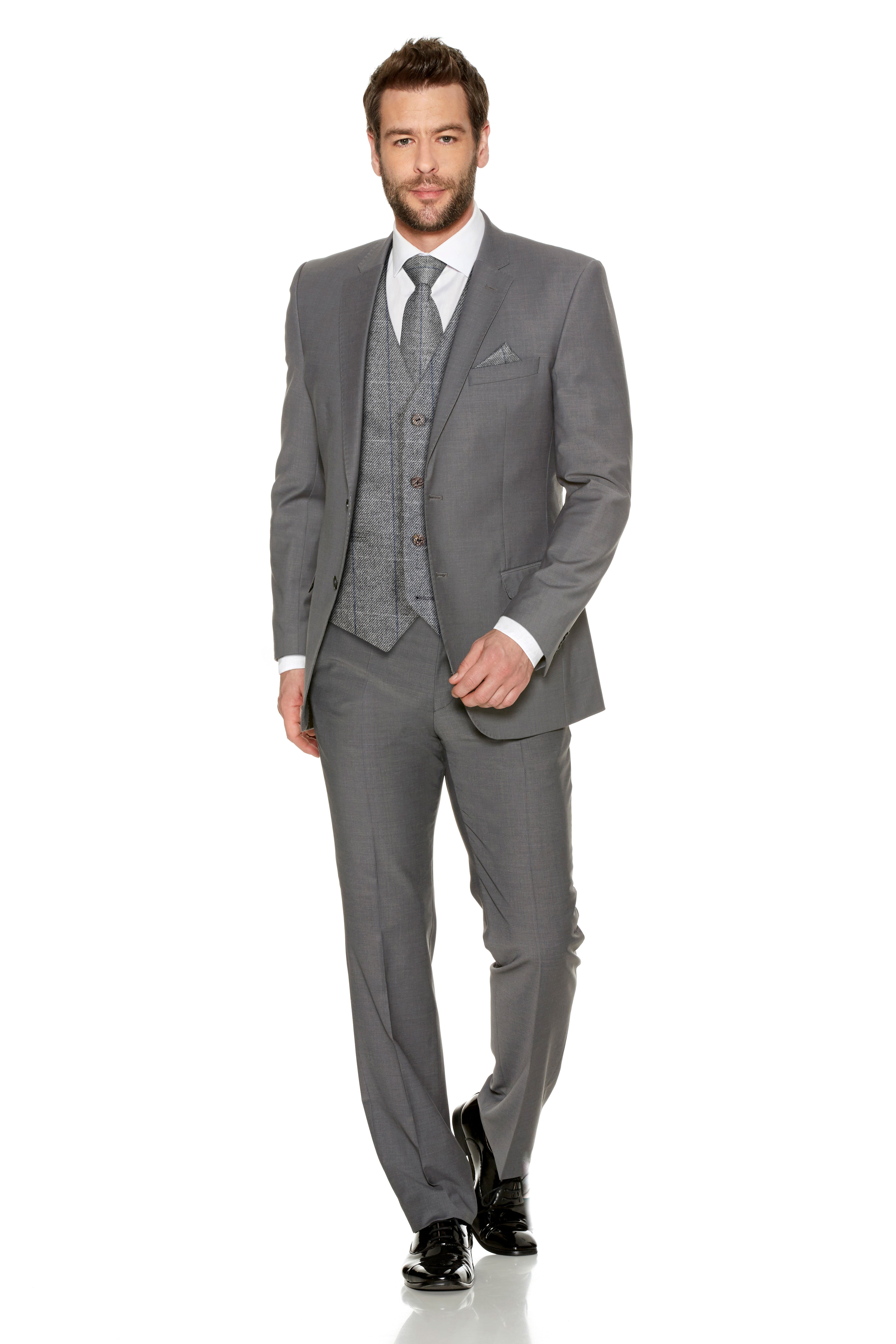 Groom in grey slim fit suit with textured waistcoat and tie